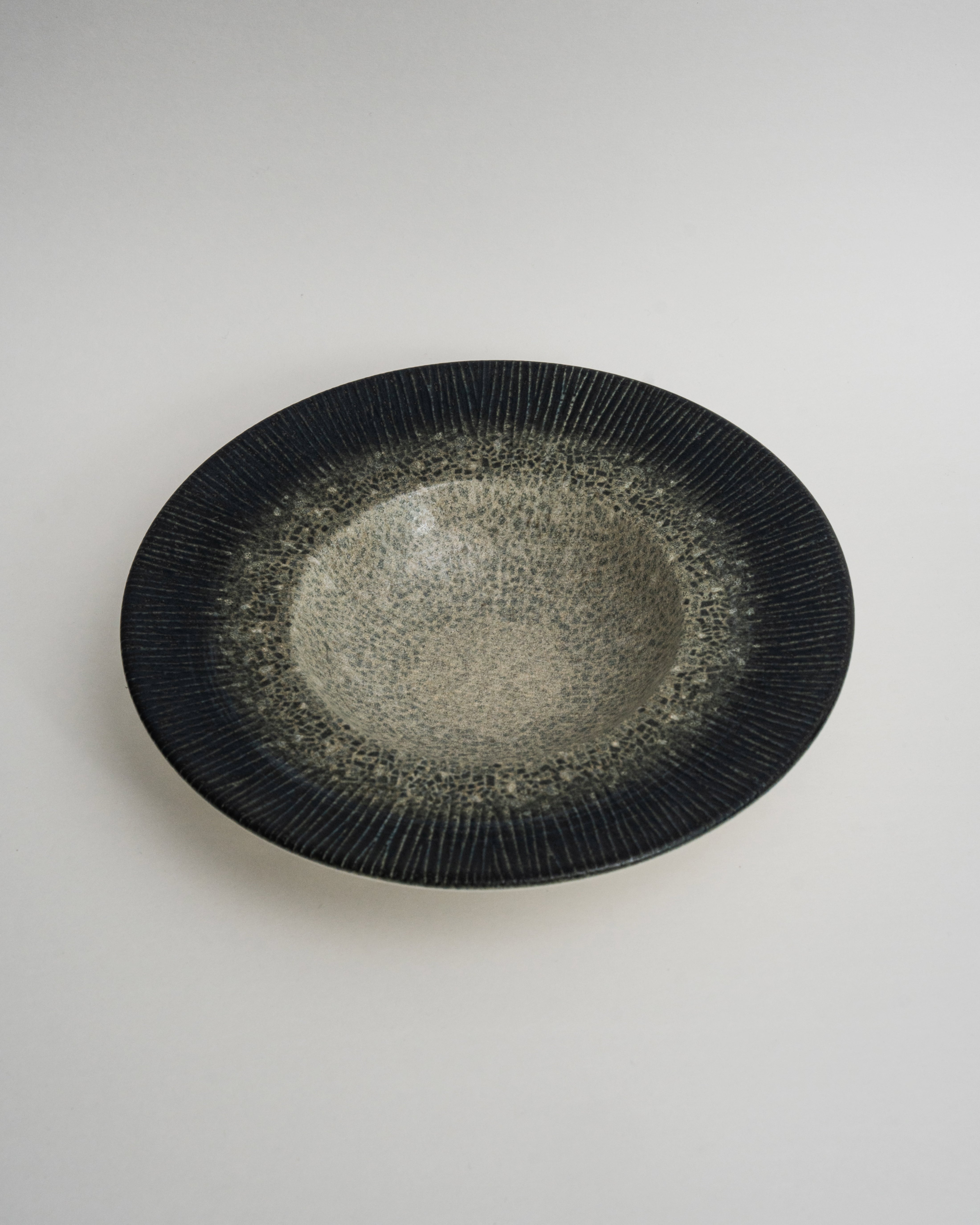Arctic porcelain banquet plate, black to white gradient glaze, 11 inch