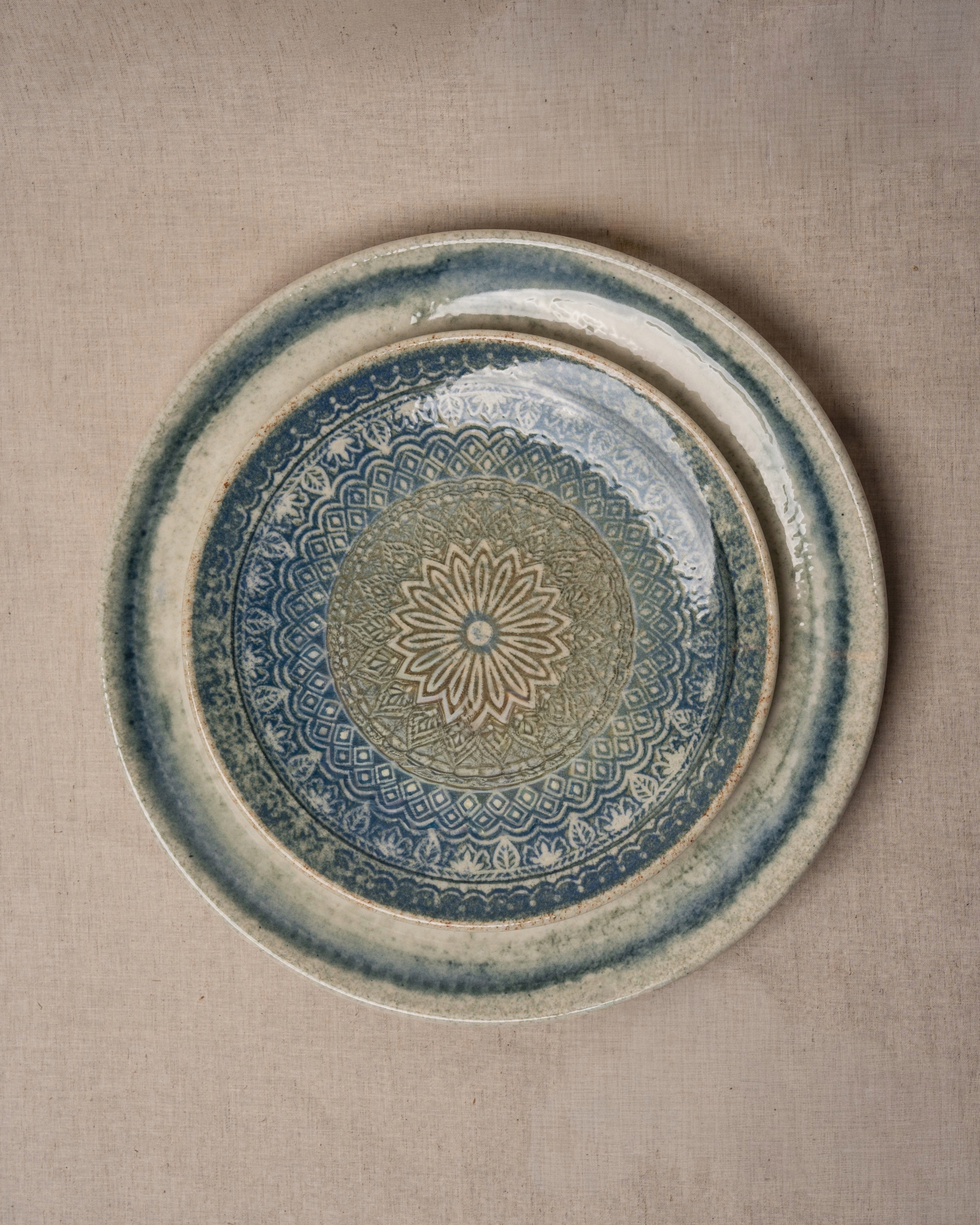 Close-up of glaze texture and speckled pattern on Atlantis porcelain plate with matching side plate