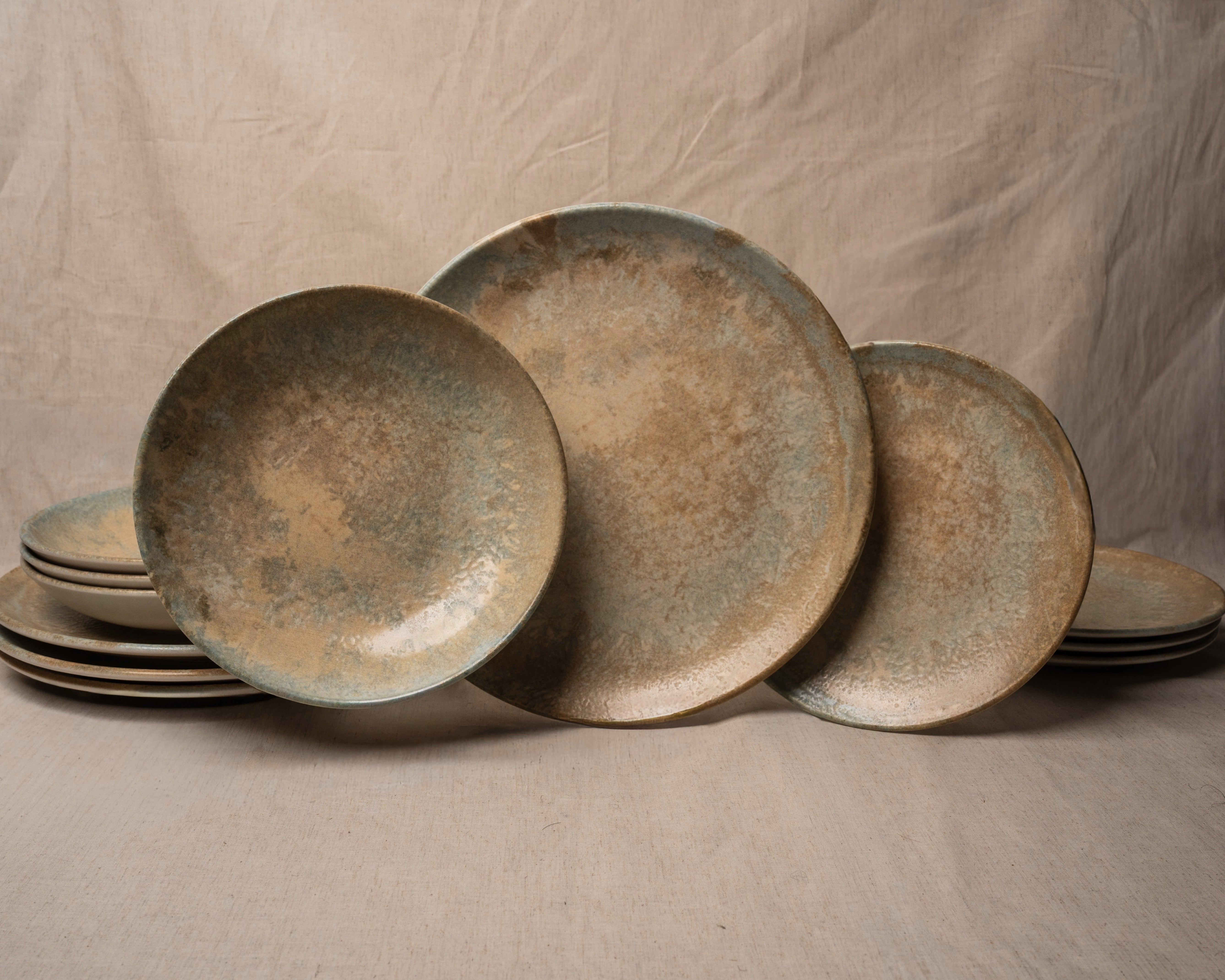 Aurelia porcelain dinnerware set, bronze-toned glaze, full 12-piece collection