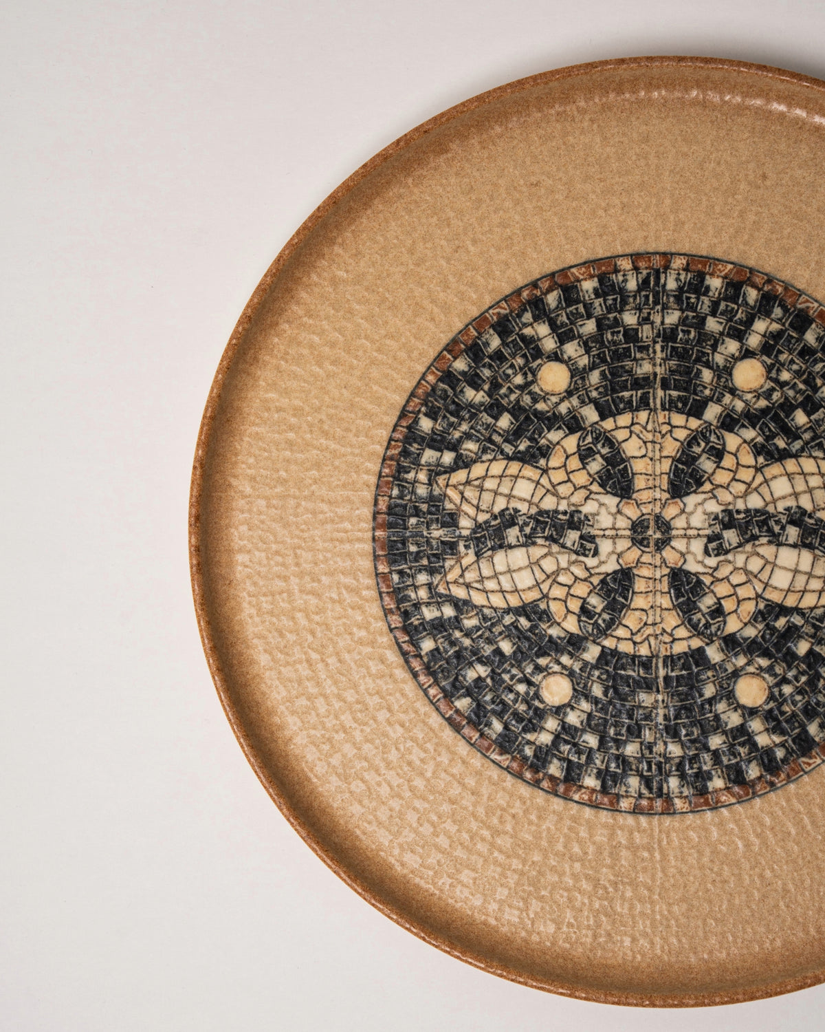 Close overhead view of Bee Mosaïque Beige porcelain dinner plate, mosaic pattern