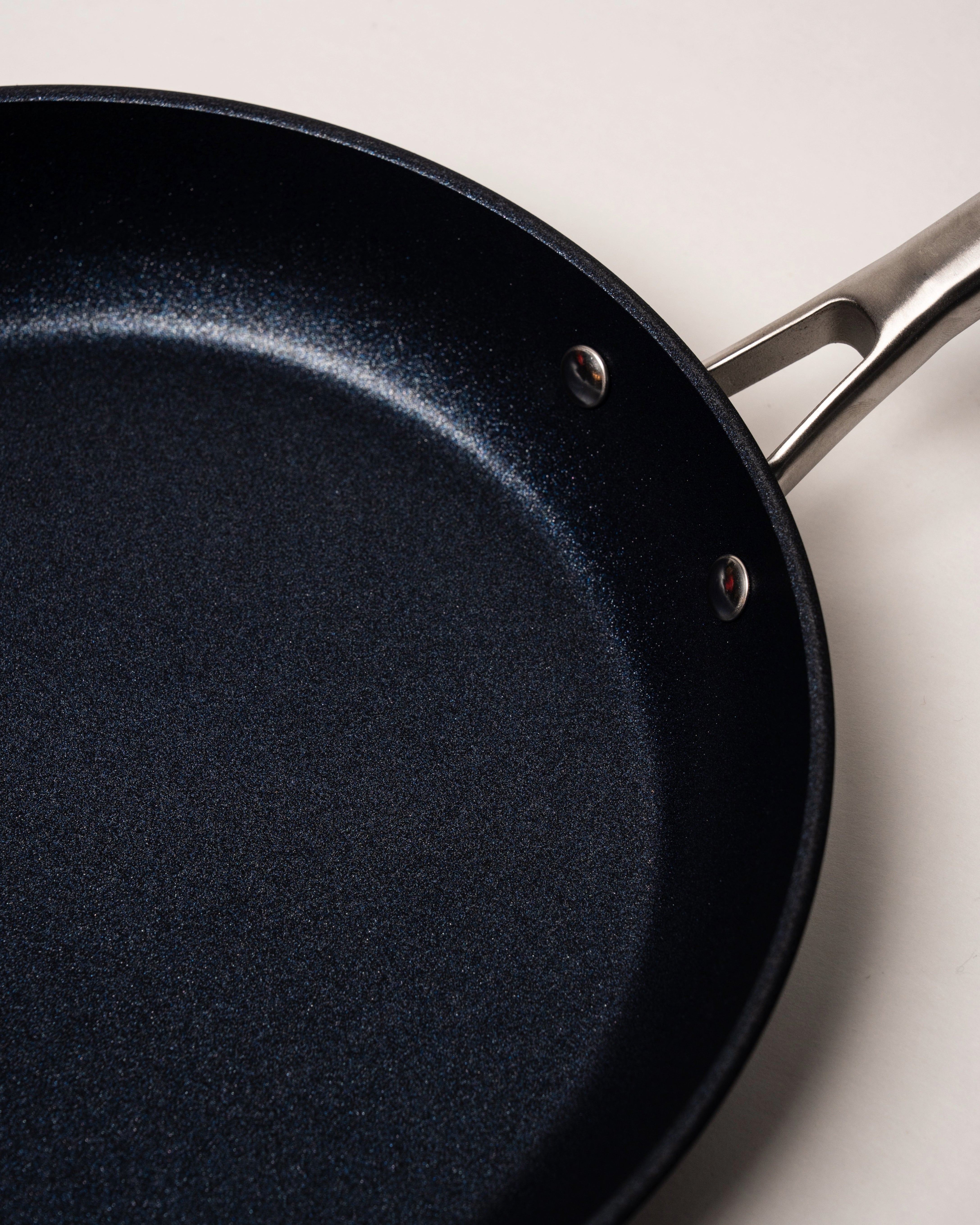 Angled view of BioDiamond diamond-coated frying pan, 11 inch, showing handle and depth