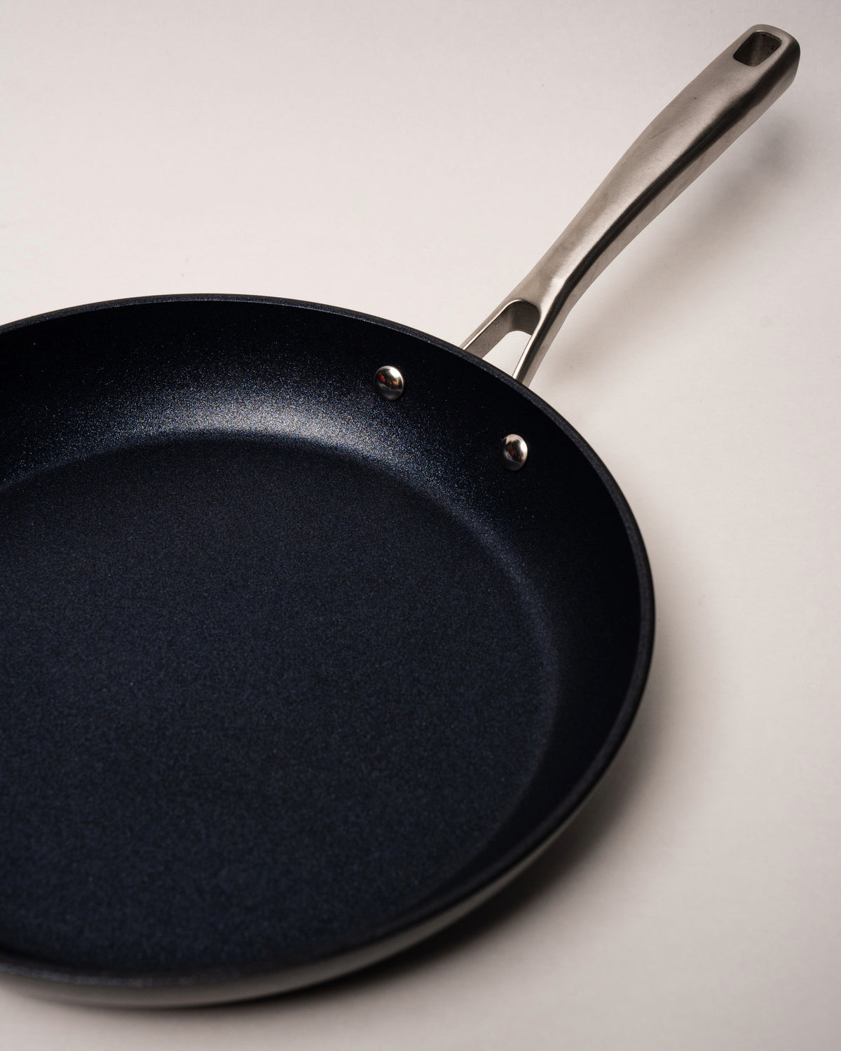 Side angled view of BioDiamond diamond-coated frying pan with long handle