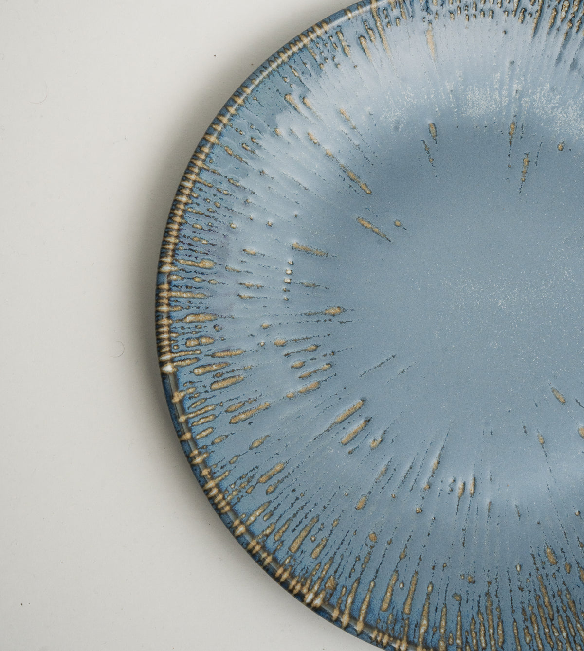 Overhead view of Colosseum Aqua porcelain dinner plate, blue finish