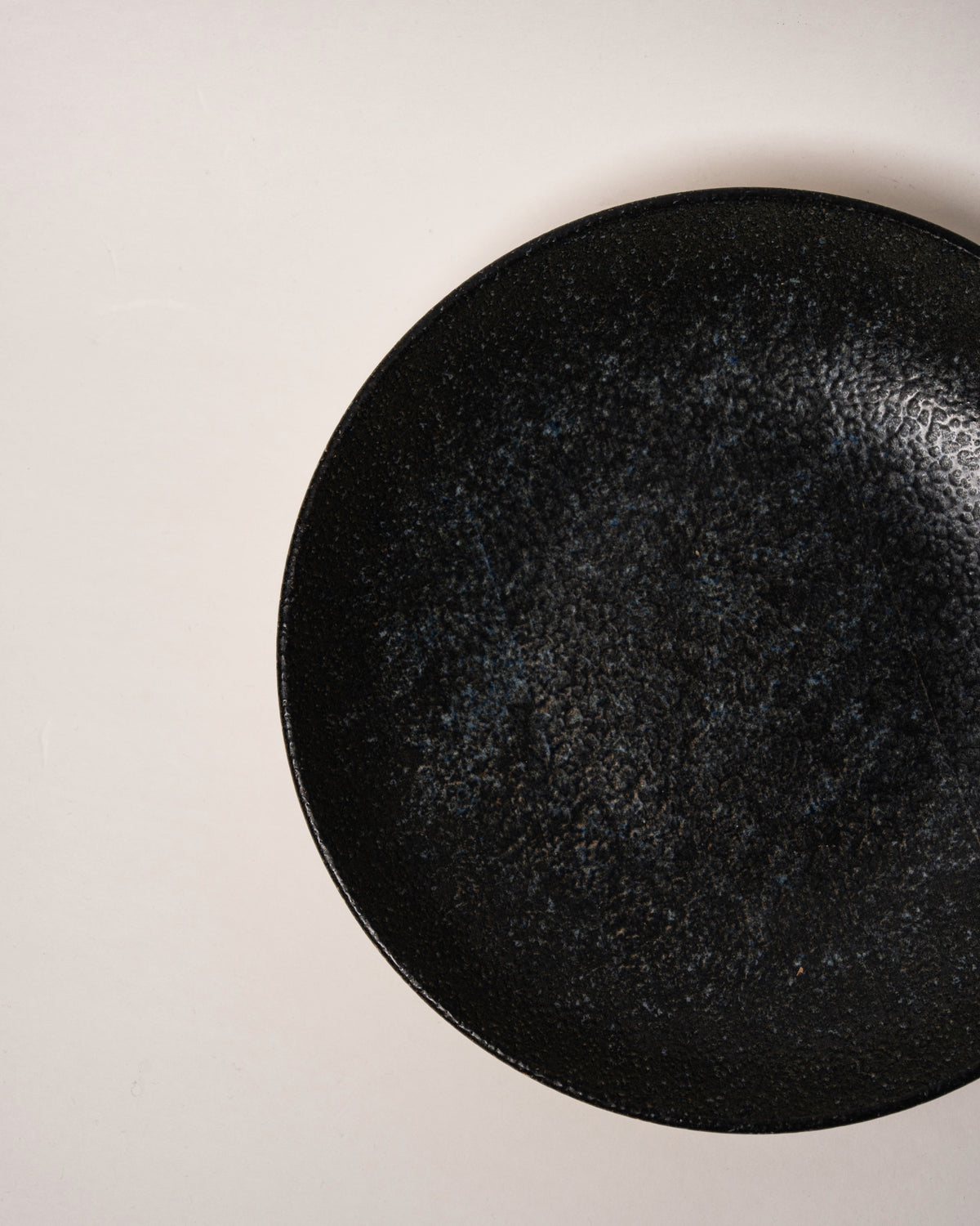 Close view of Cosmos porcelain bistro bowl, speckled starry texture