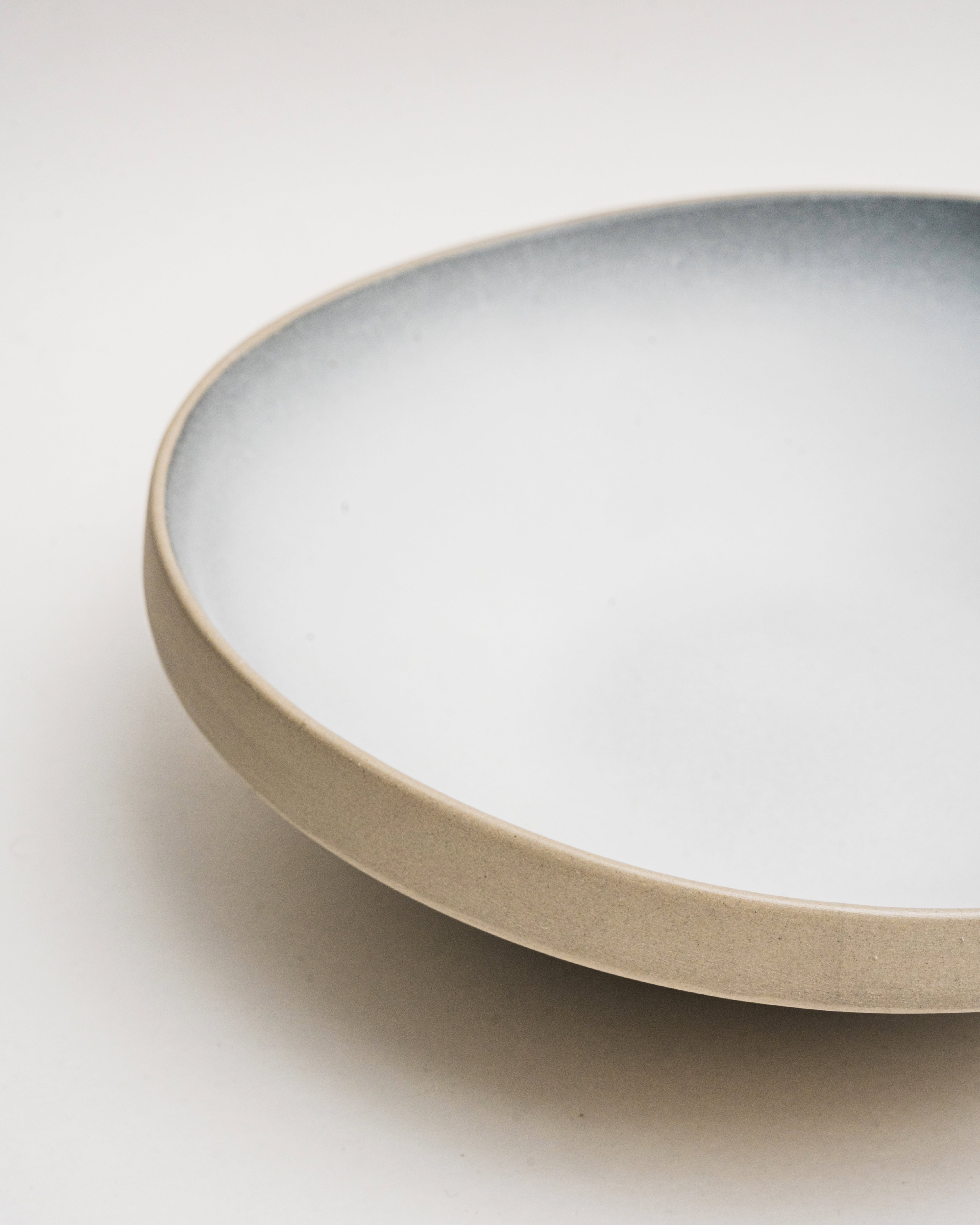 Overhead view of Crater porcelain bistro bowl showing two-tone glaze