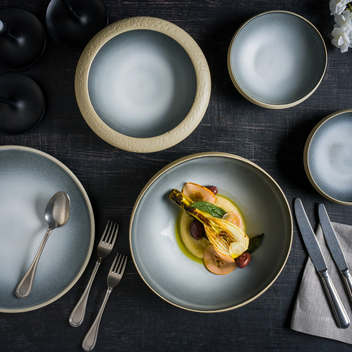 Crater porcelain bistro bowl styled on table setting with food