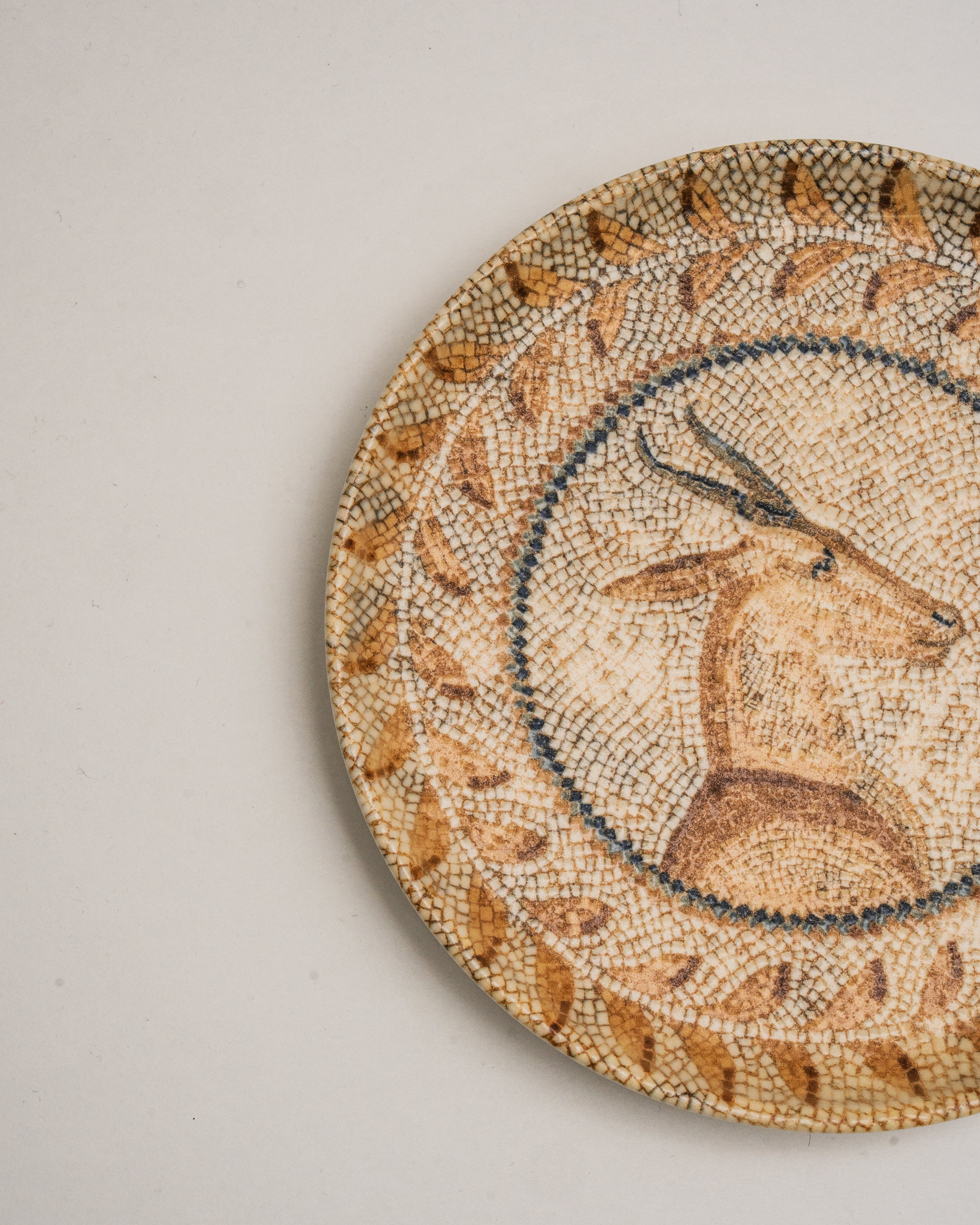 Overhead view of Deer Mosaïque porcelain plate showing deer illustration and mosaic detail