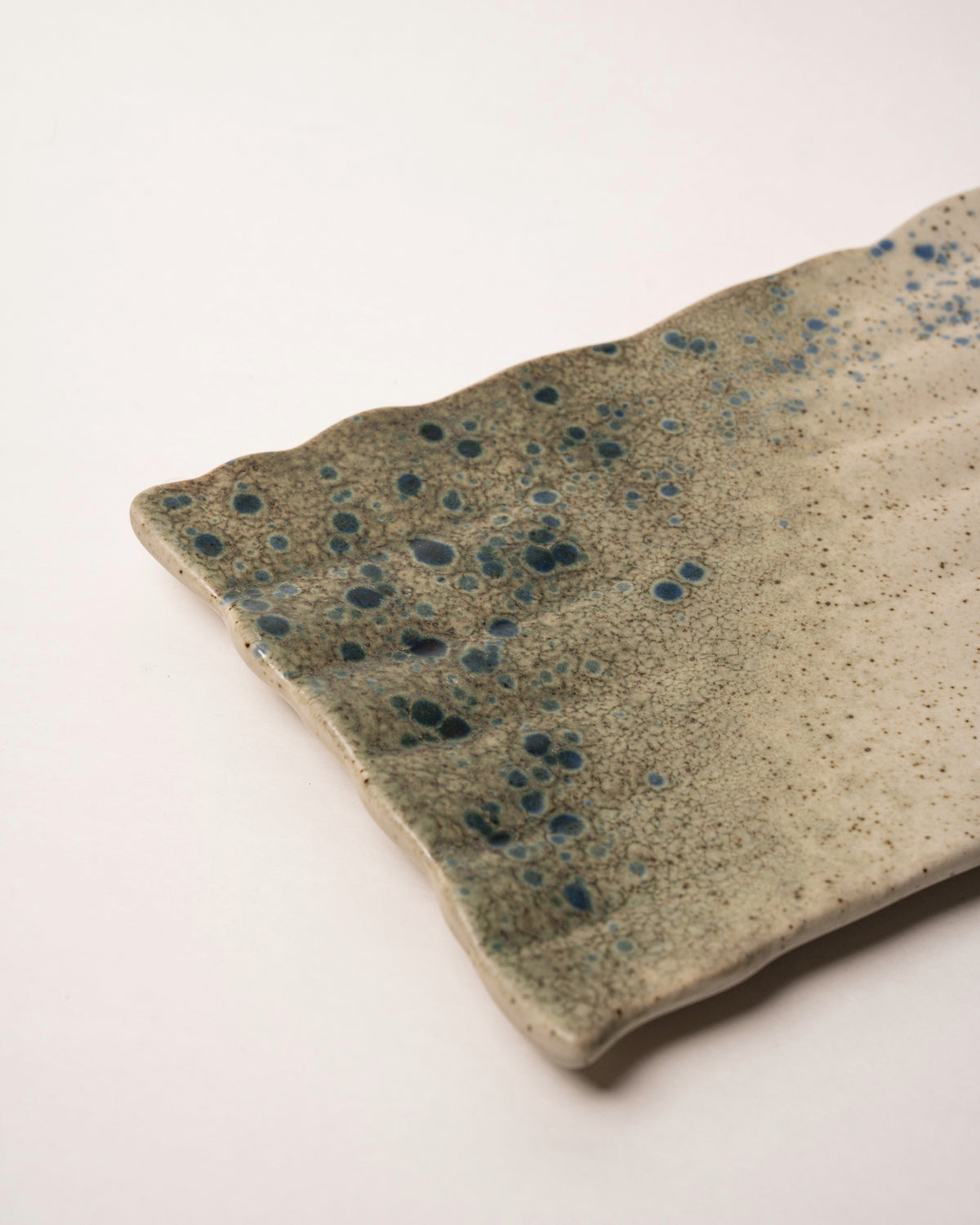 Side view of Gaia porcelain rectangular plate, blue-grey finish
