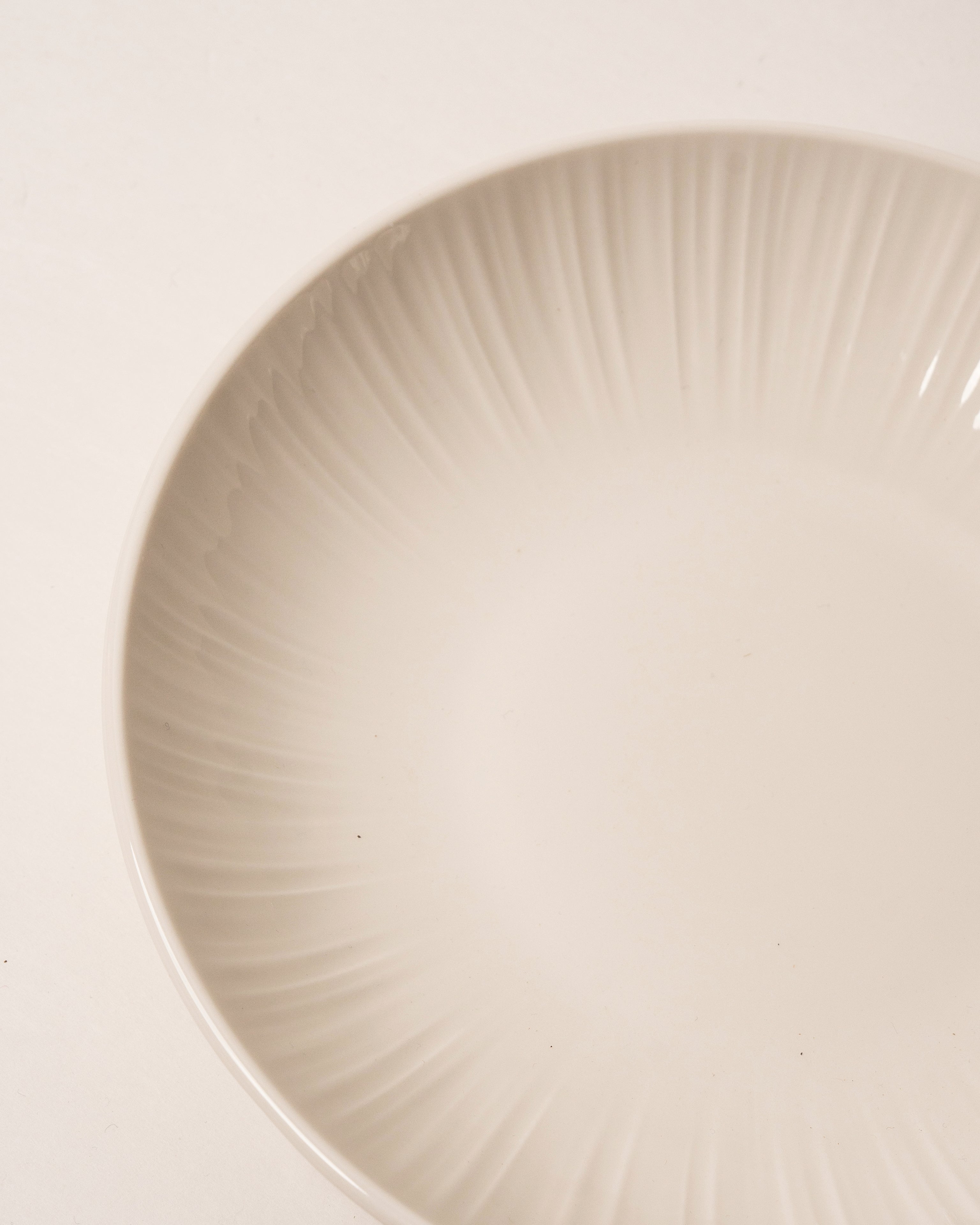 Overhead view of Iris porcelain bistro bowl showing fluted rim detail