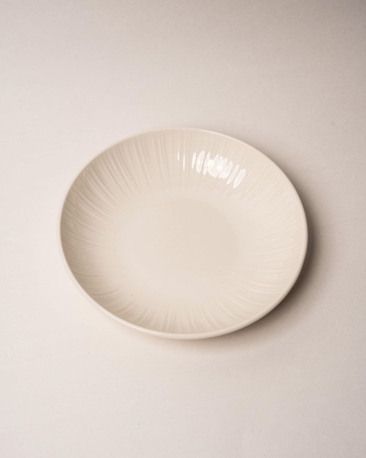 Side profile of Iris porcelain bistro bowl, fluted rim visible