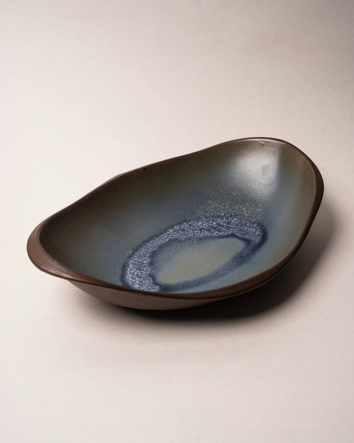 Side profile of Lagoon porcelain bistro bowl, organic shape