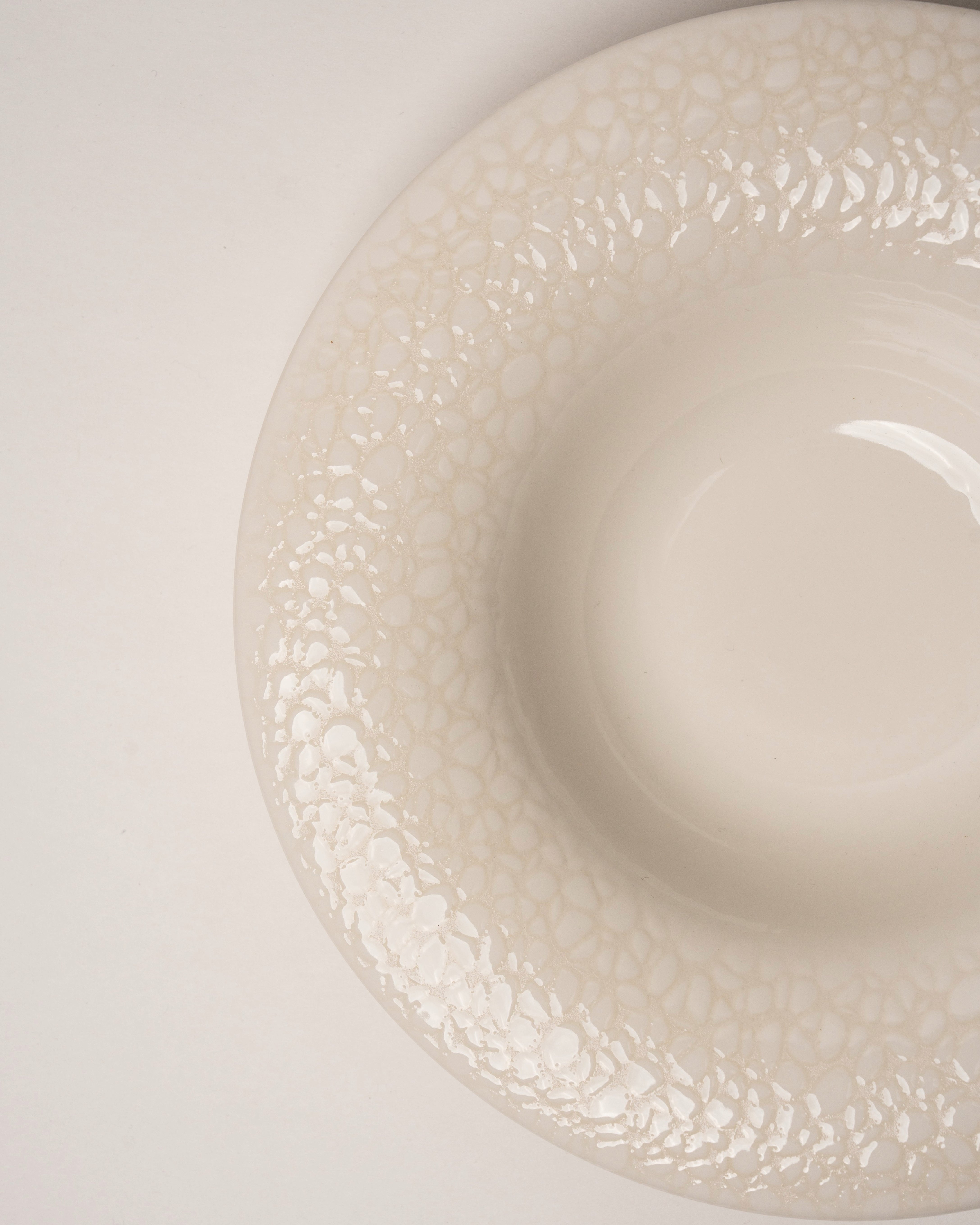 Overhead view of Marlena porcelain bistro plate showing textured glaze
