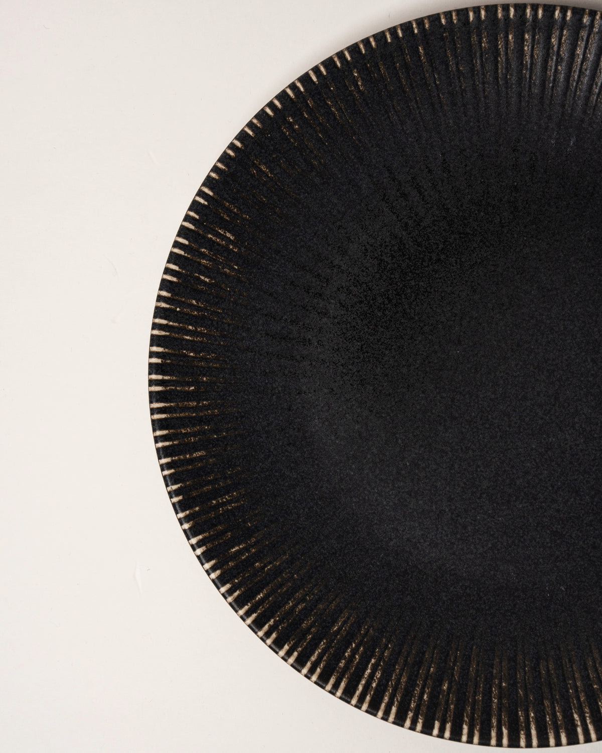 Overhead full view of Obsidian porcelain dinner plate, beaded rim visible