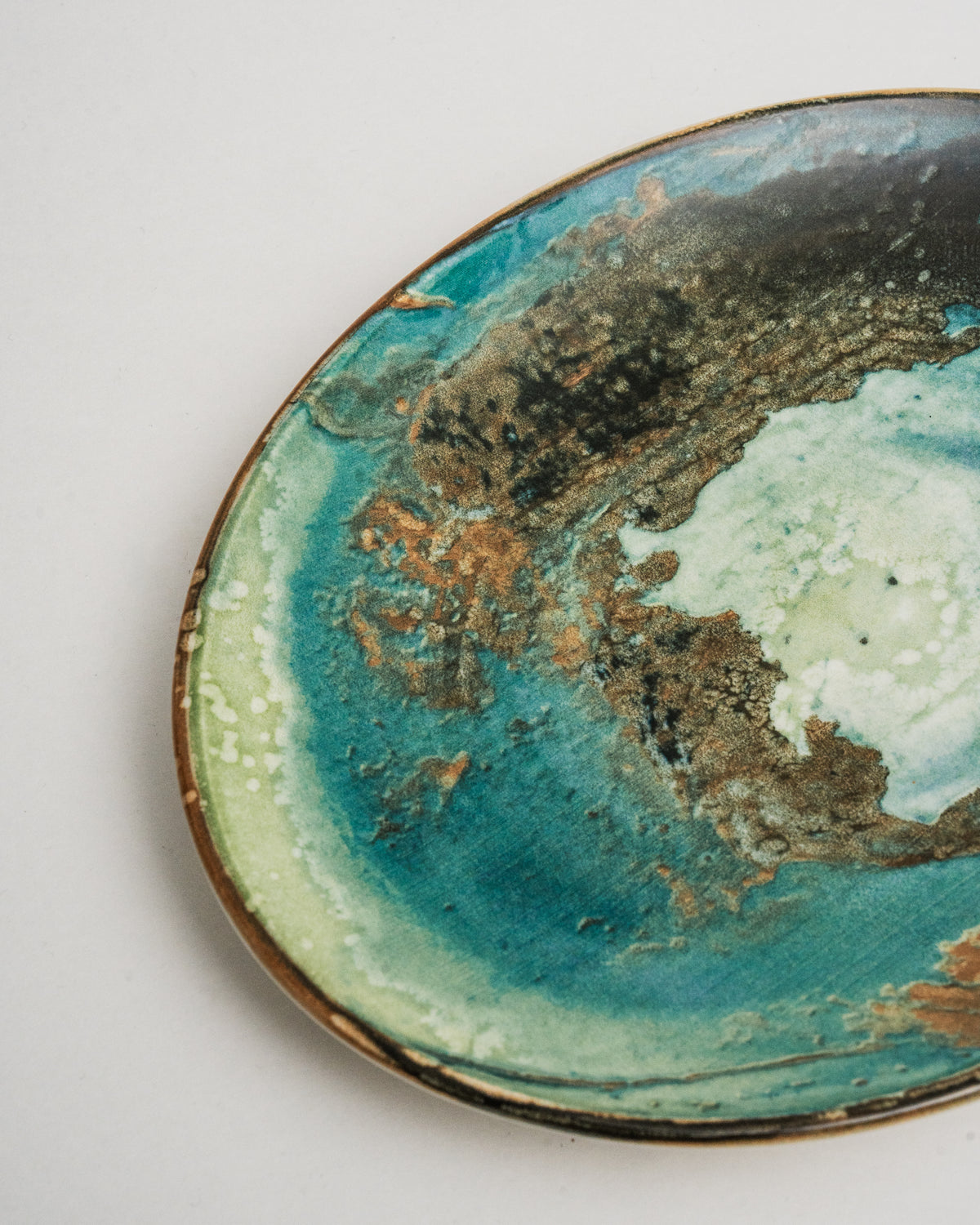 Overhead view of Pelagos porcelain oval plate, glaze pattern detail