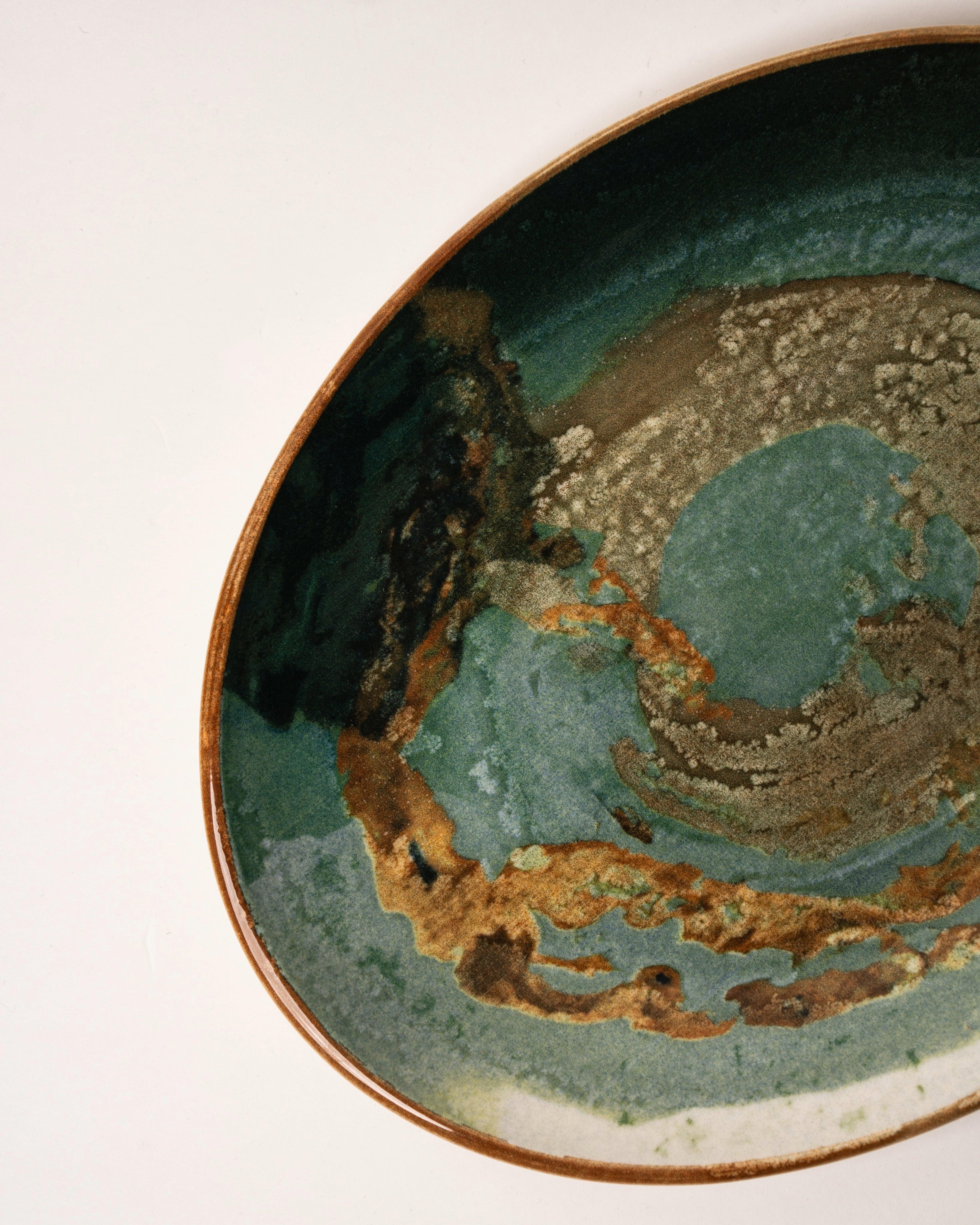 Angled view of Pelagos porcelain oval platter showing glaze detail