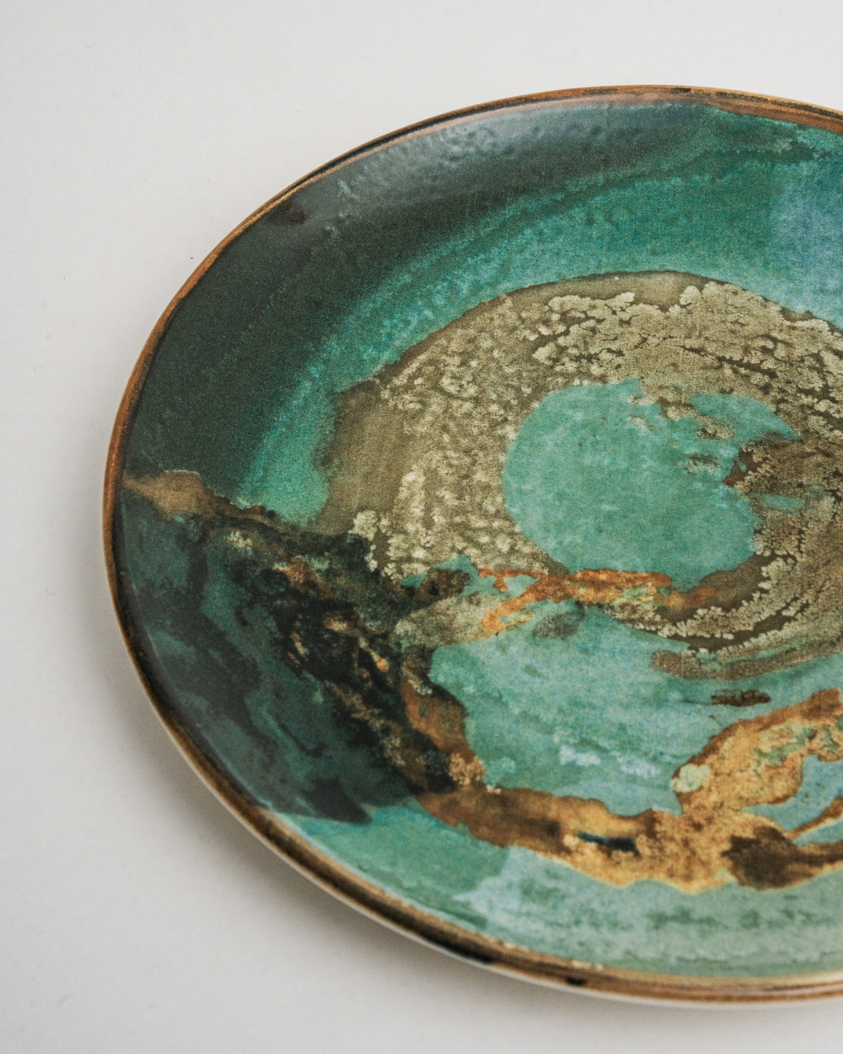 Overhead view of Pelagos porcelain dinner plate, glaze pattern detail