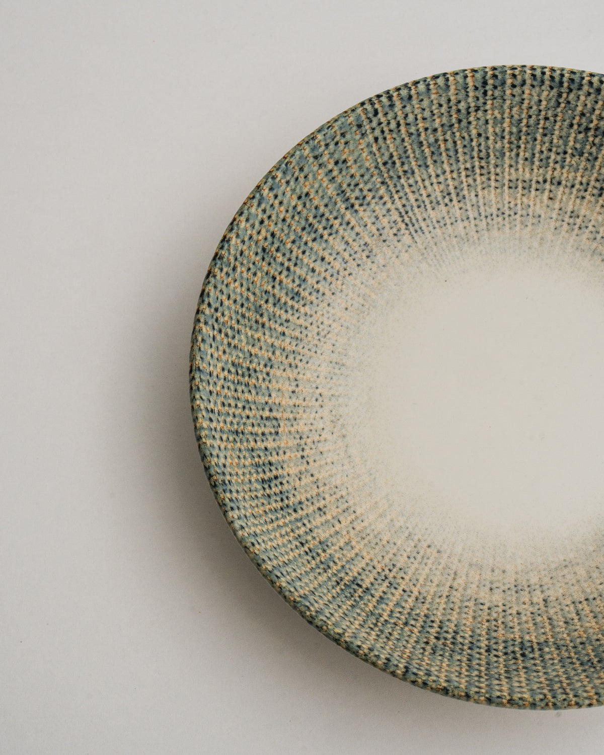 Close overhead view of Python porcelain bistro bowl, glaze texture