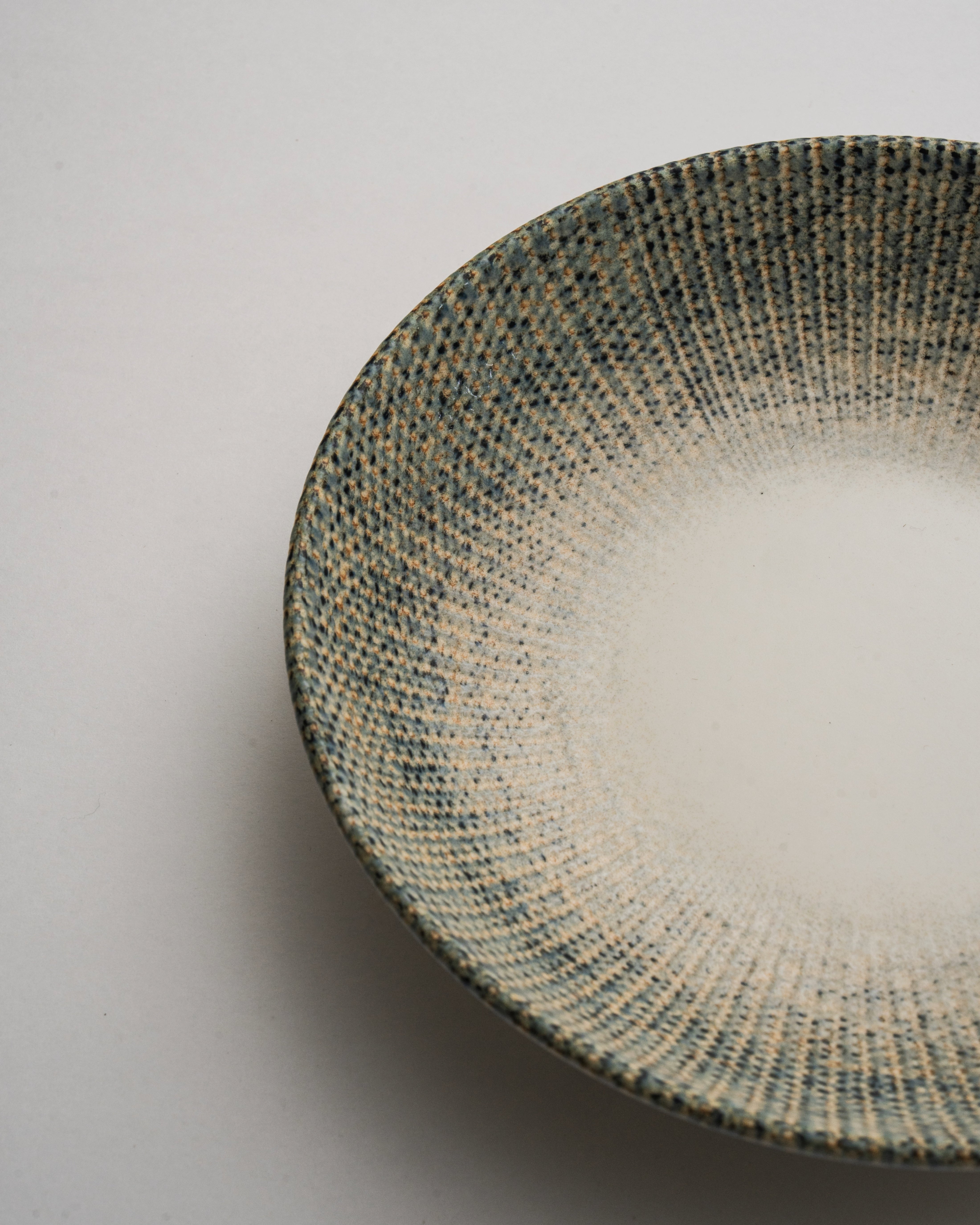Overhead view of Python porcelain bistro bowl showing textured rim detail