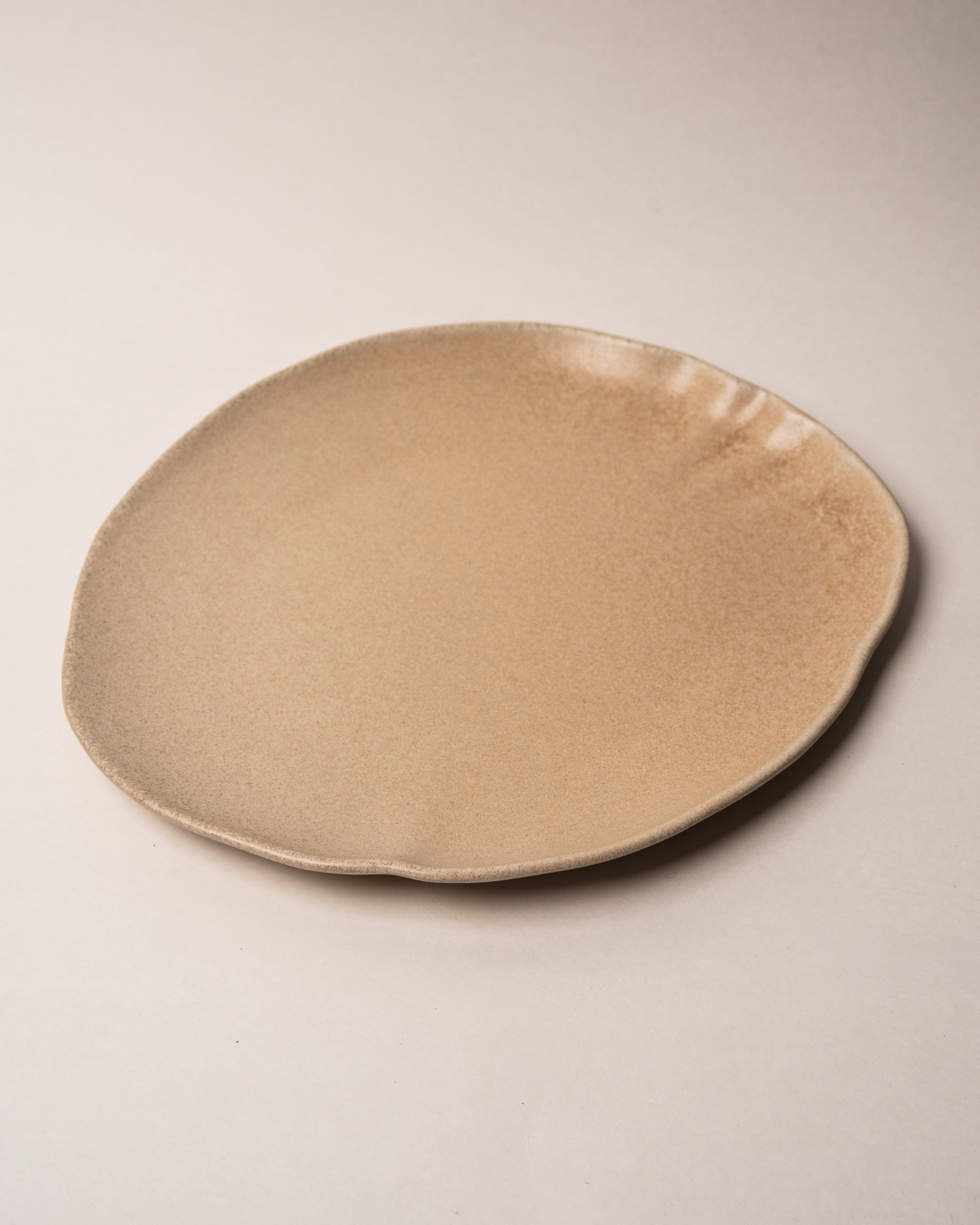 Overhead view of Sahara porcelain dinner plate, full glaze visible