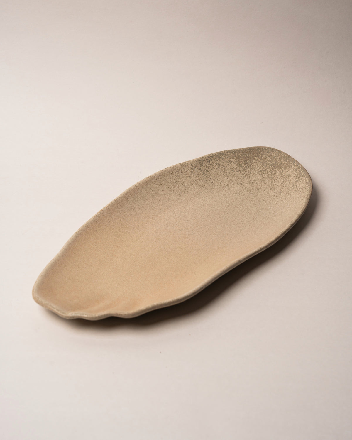 Overhead view of Sahara porcelain rectangular plate, full glaze visible