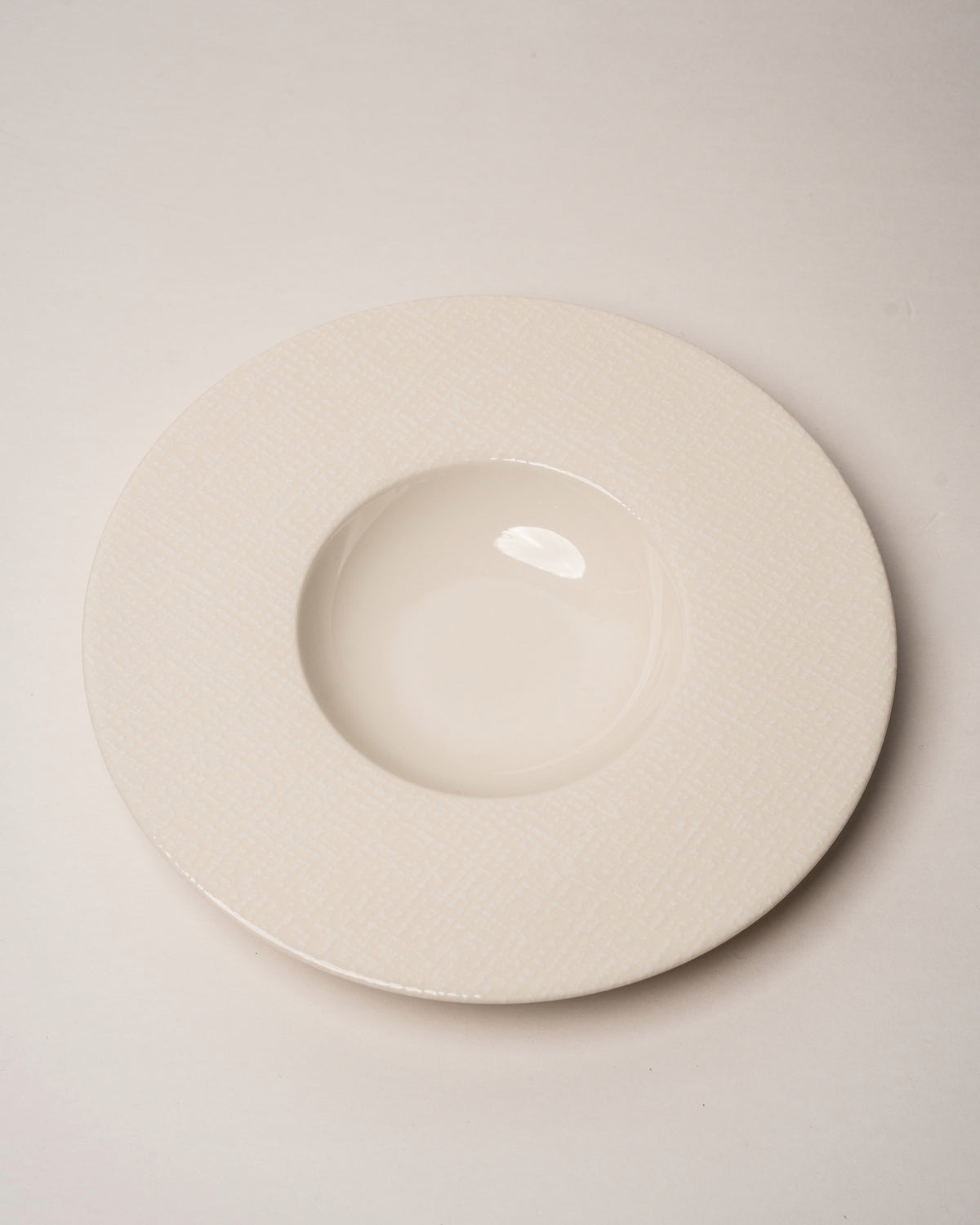 Overhead angled view of Serene porcelain banquet plate