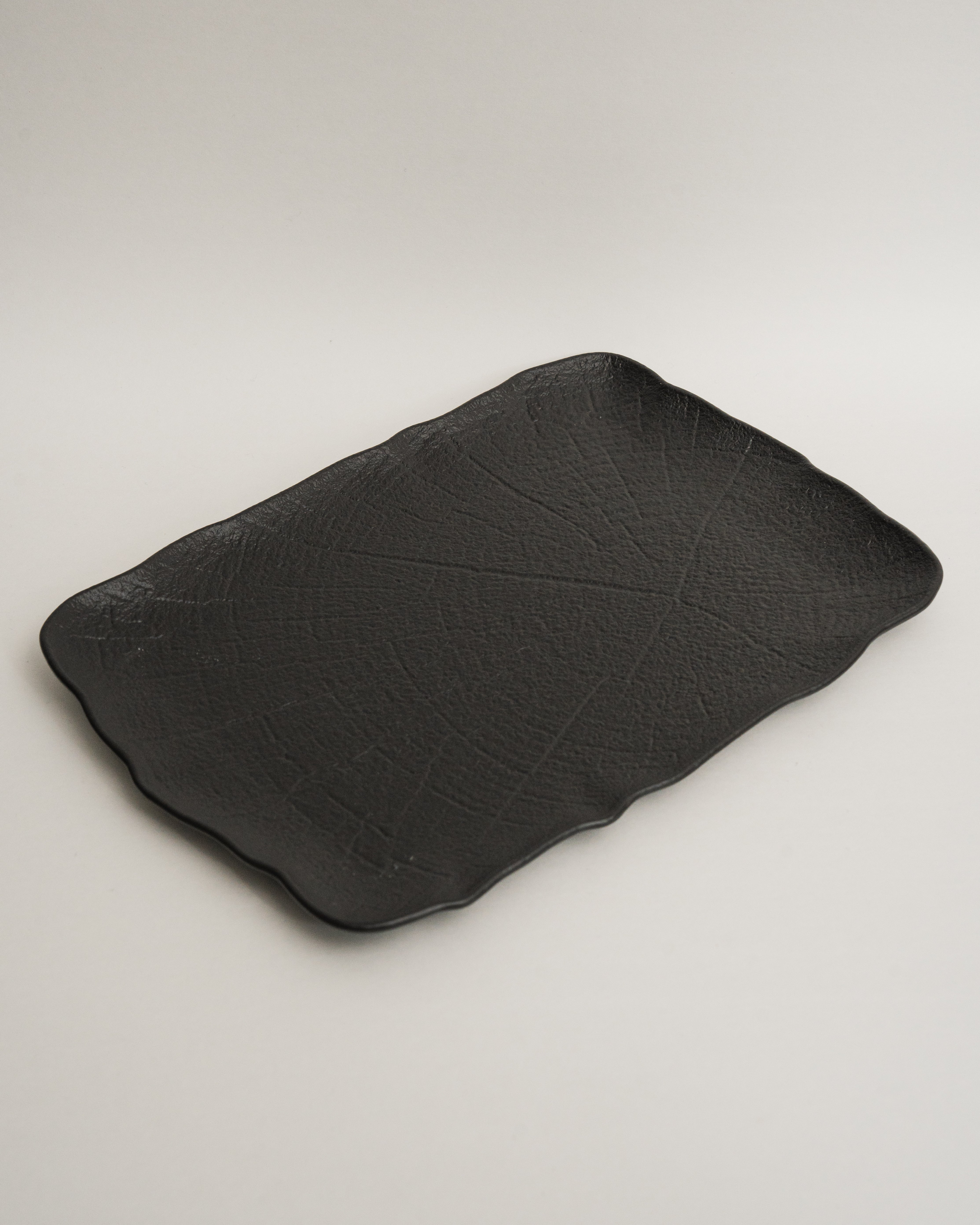 Shade porcelain platter, matte black finish, organic shape, 13 by 9.1 inch