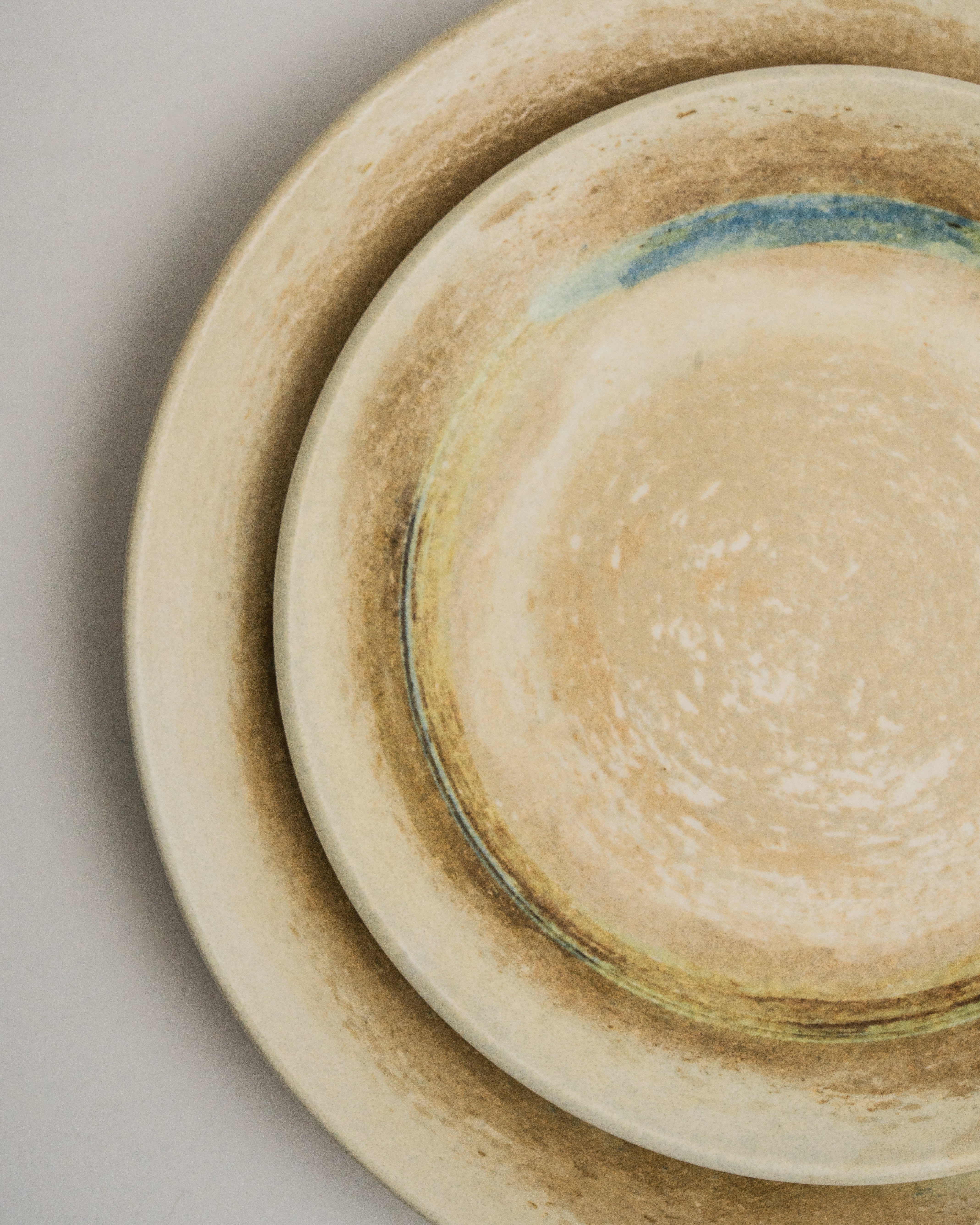 Overhead view of Tranquil porcelain dinner plate showing blue rim accent