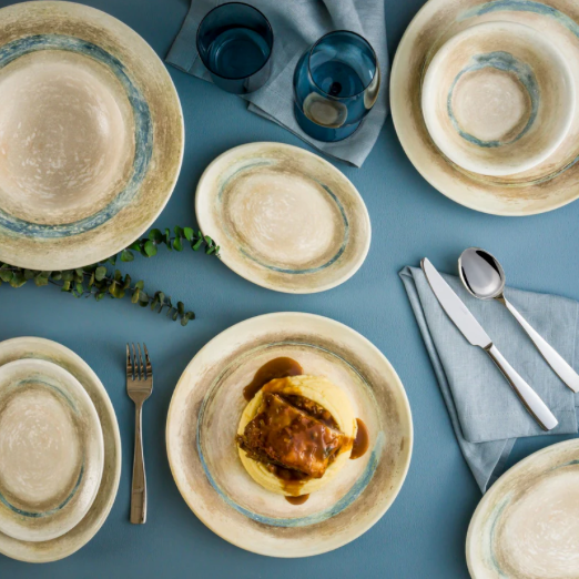 Tranquil porcelain dinner plate styled on table setting with food