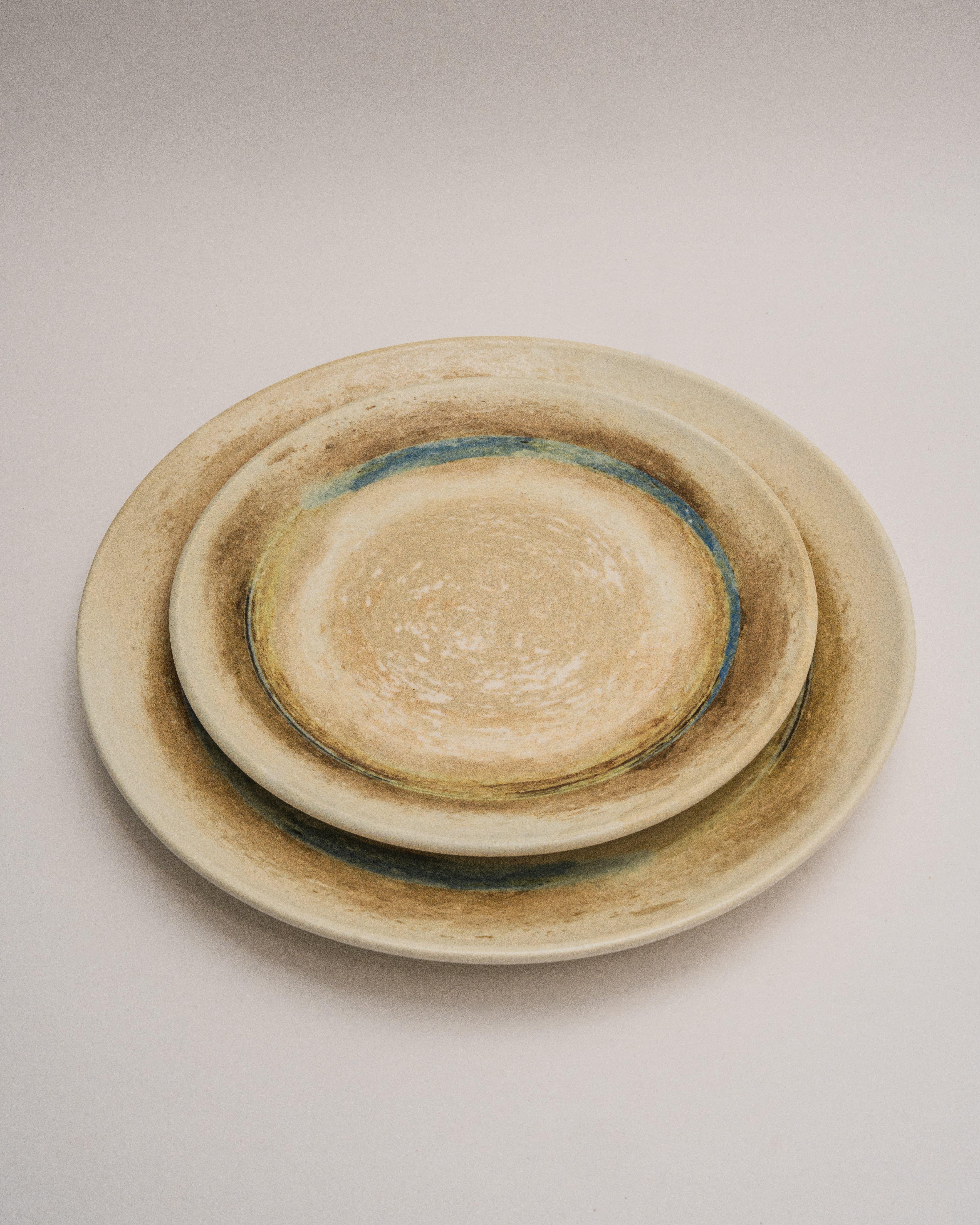 Tranquil porcelain dinner plates, sand-toned glaze with blue rim, nested pair